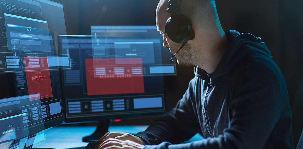 hacker with access denied messages on computers