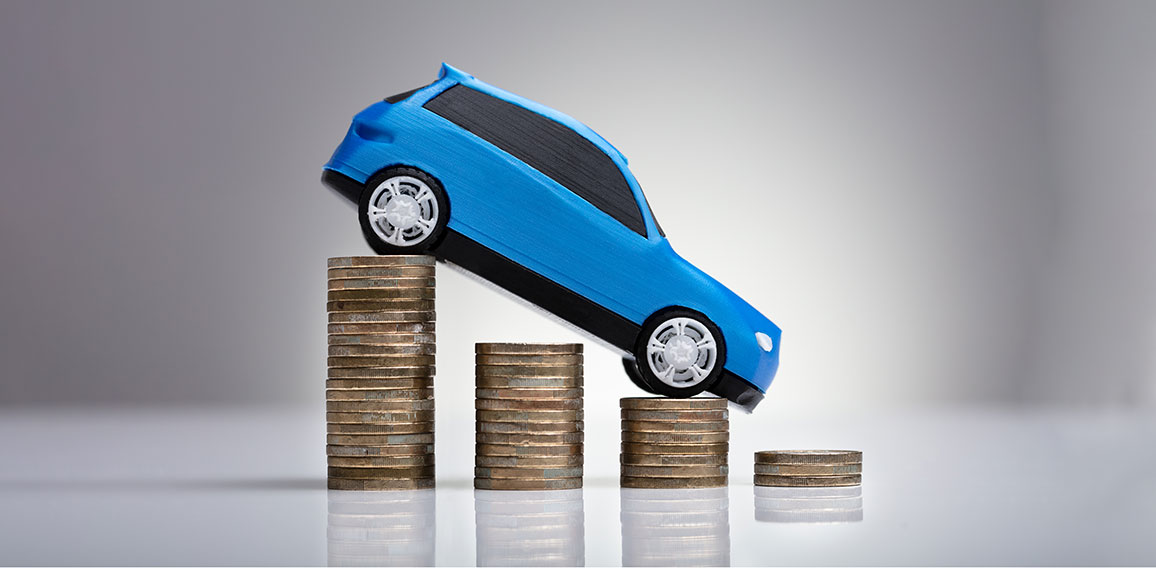 Blue Car Over Stacked Coins