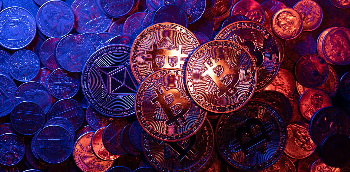 Shiny Bitcoin coins on piled up Ethereum and US Dollar coins