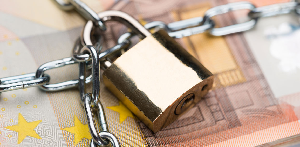 Chain And Padlock Around Euro Banknotes