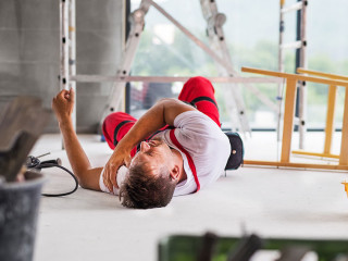 An accident of a man worker at the construction site.