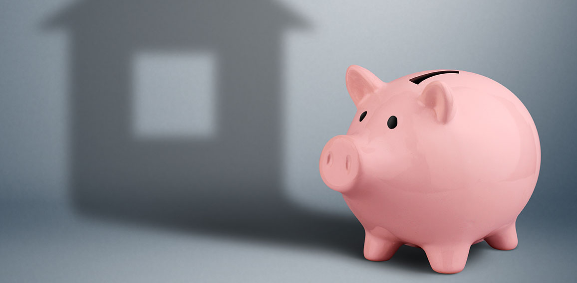 Piggy bank with shadow as house,housing industry finance concept