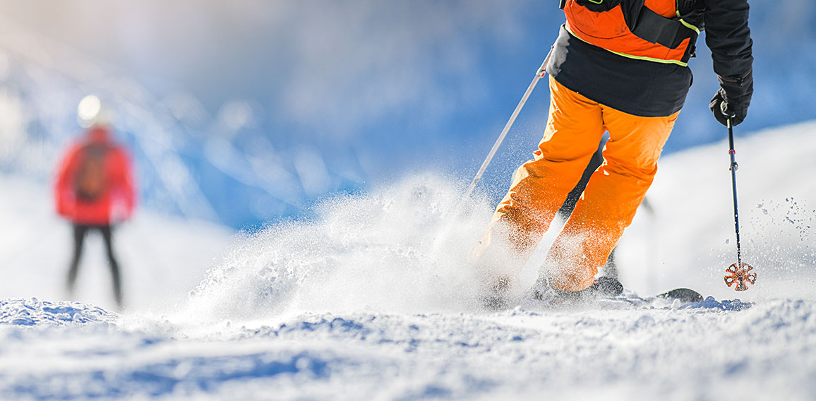 Winter ski sport activities in sunny day. Skier detail panorama