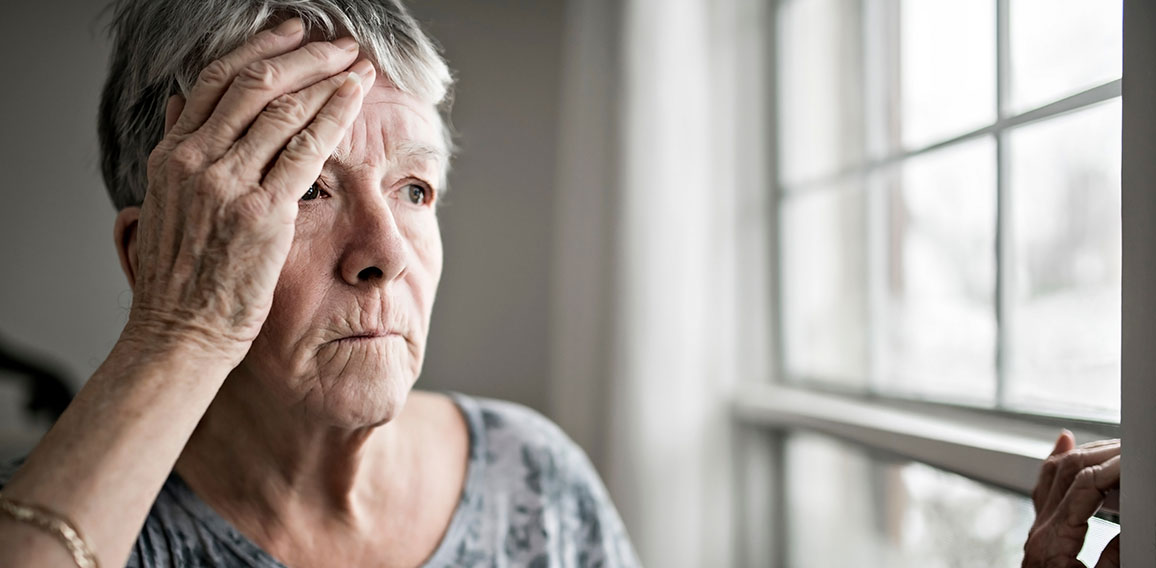 A sad lonely 70 years old senior in is apartment