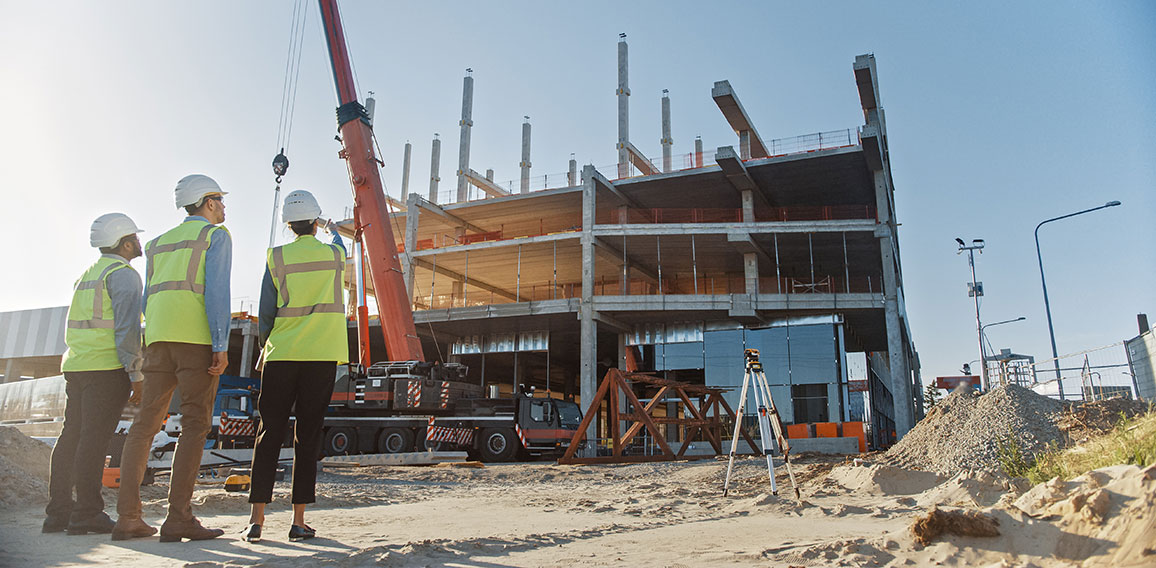 Diverse Team of Specialists Inspect Commercial, Industrial Build