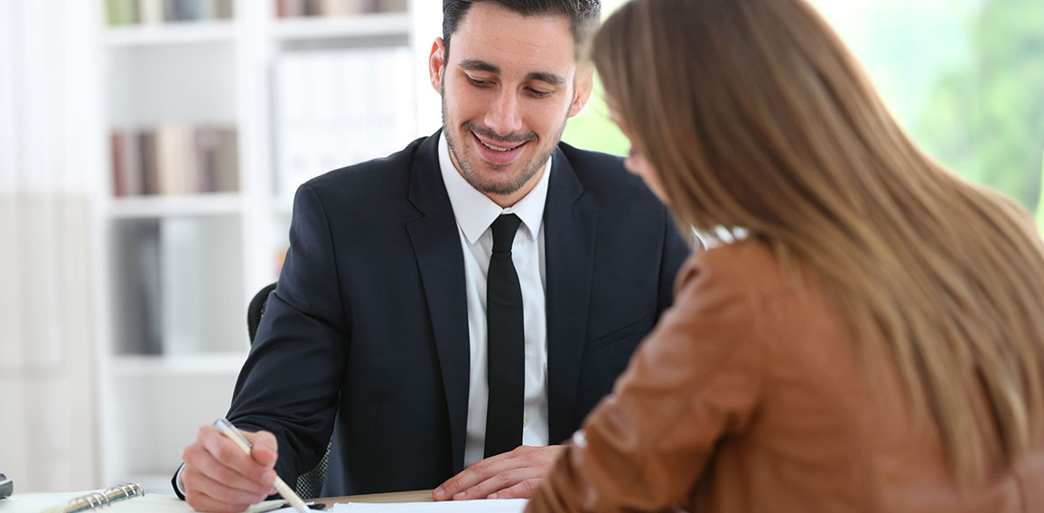 Woman meeting financial adviser in office