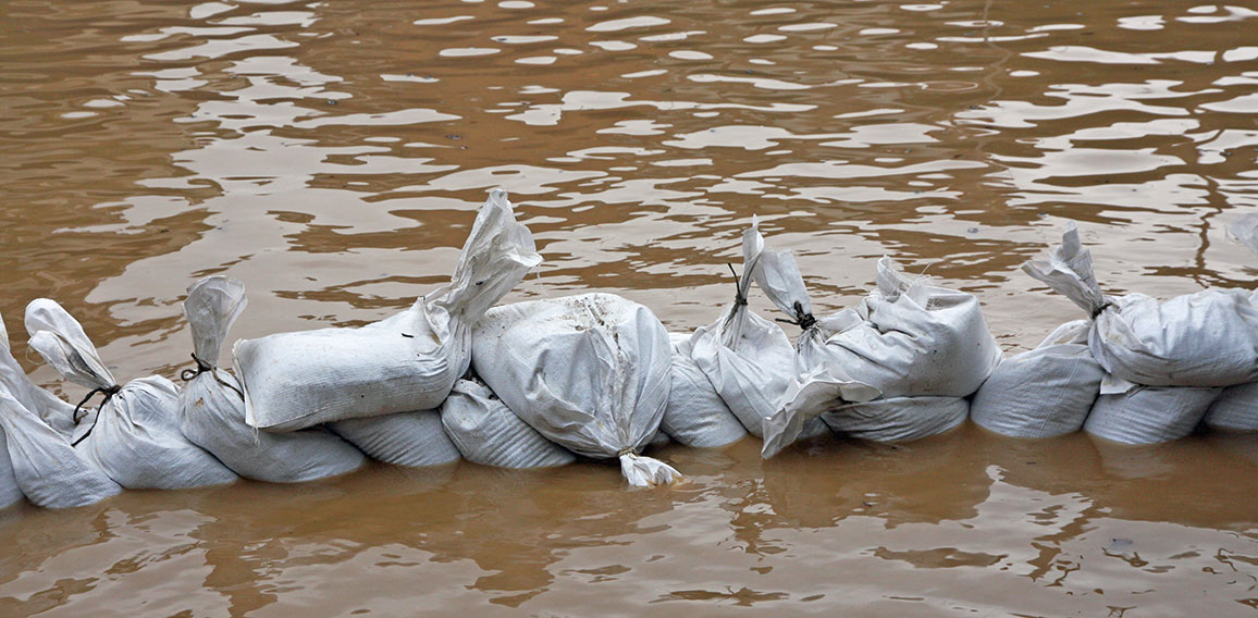 wall of sandbags to fend off raging river