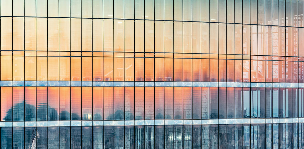 Exterior of the new office building at sunset time.