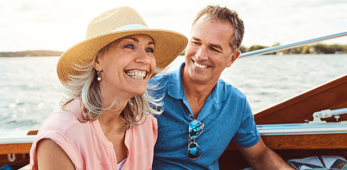 Nothing says summer like a relaxing boat ride. a mature couple enjoying a relaxing boat ride.