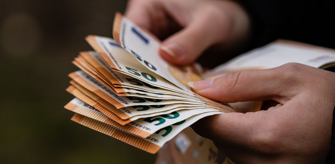 Woman counting money, counting EURO close up