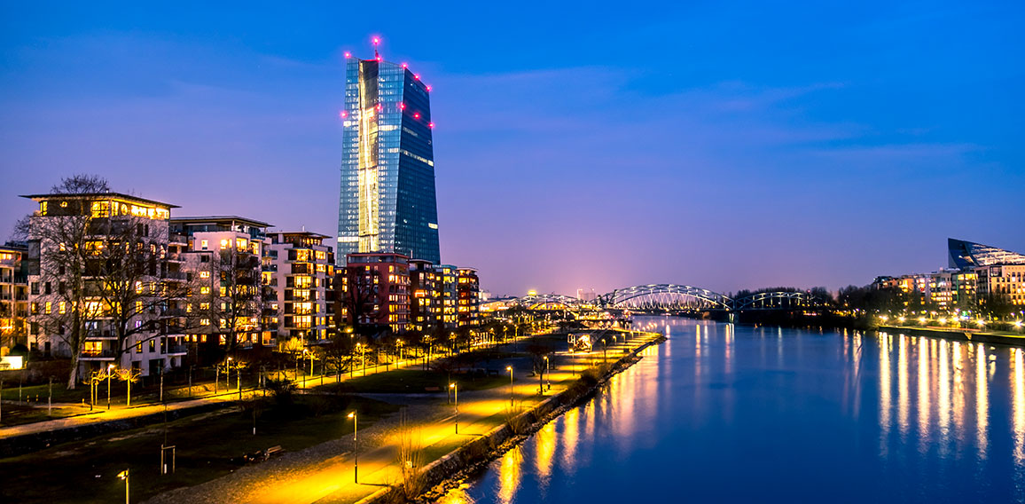 The skyline of Frankfurt, Germany, with the European Central Bank tower at night - All logos and brands removed