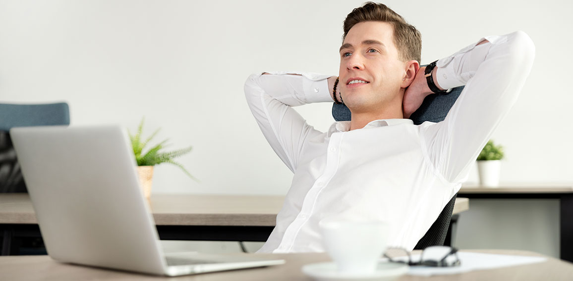 Smiling businessman relaxing in the office