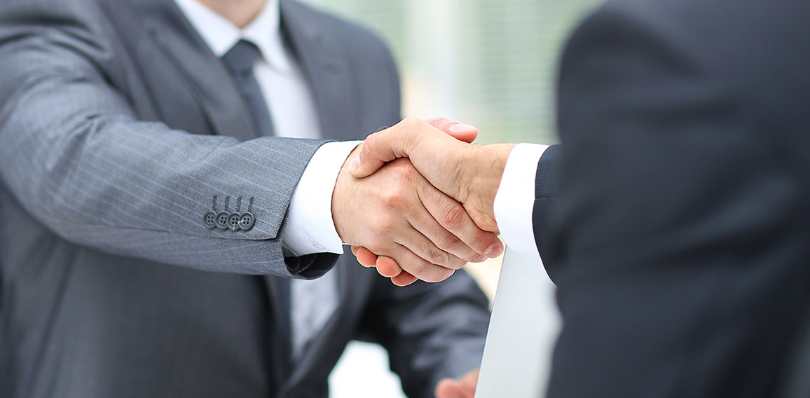 Business man shaking hand to partner