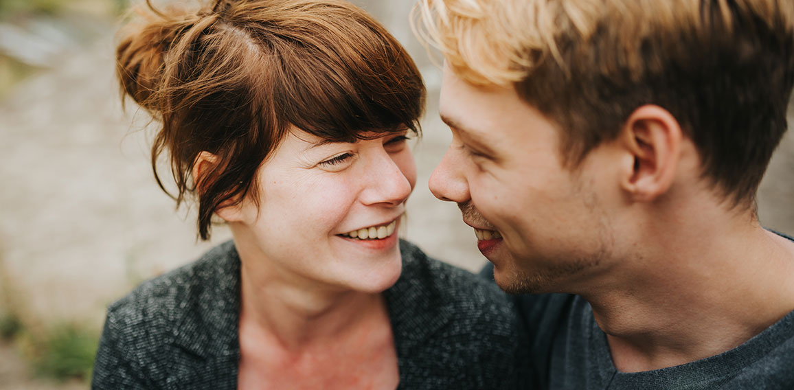 young heterosexual couple in love looking at each other