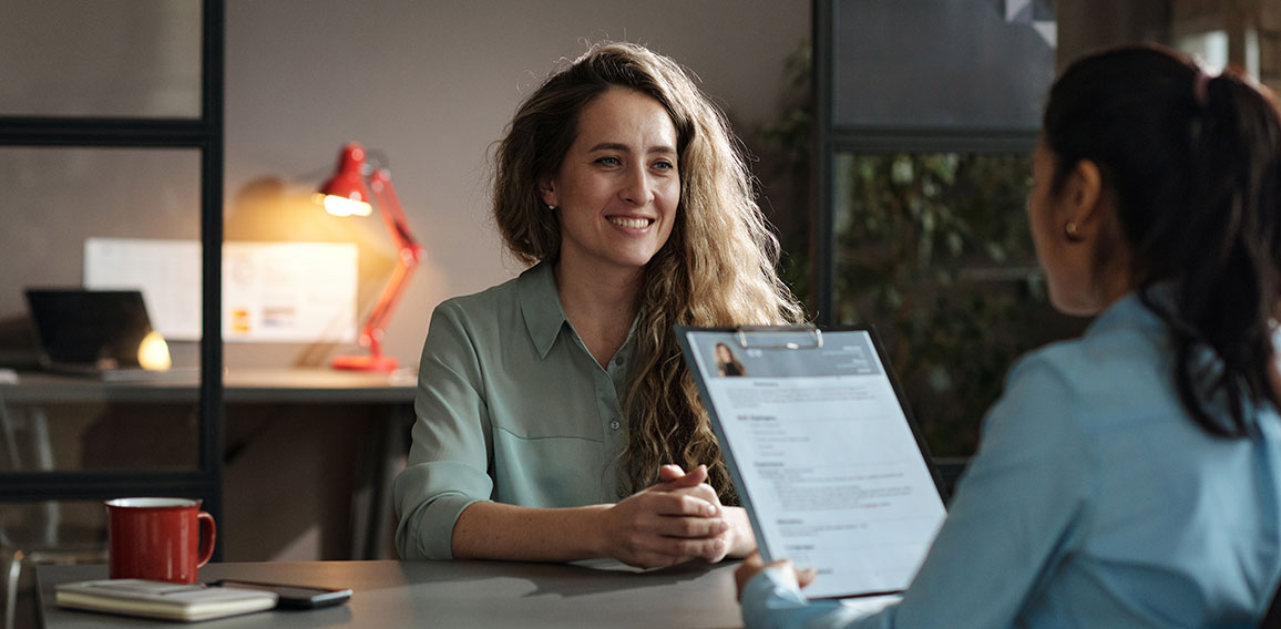 Woman presenting her resume successfully