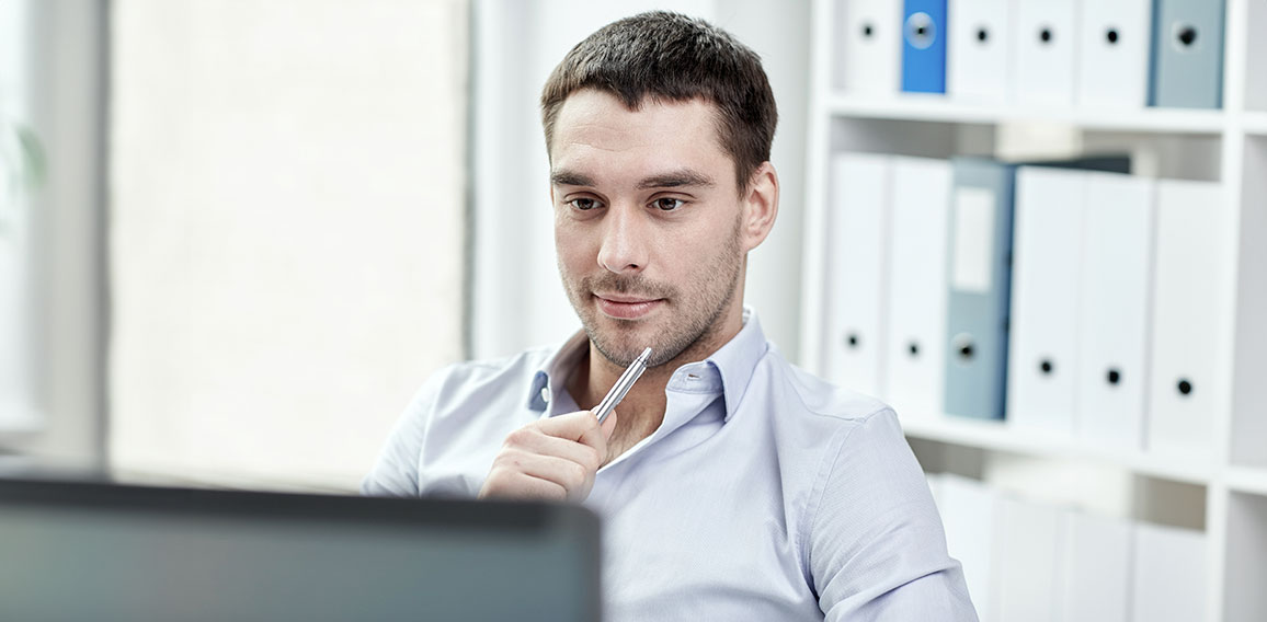 young businessman with laptop computer at office