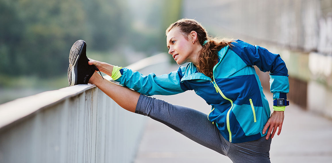 Picture of woman stretching legs before running