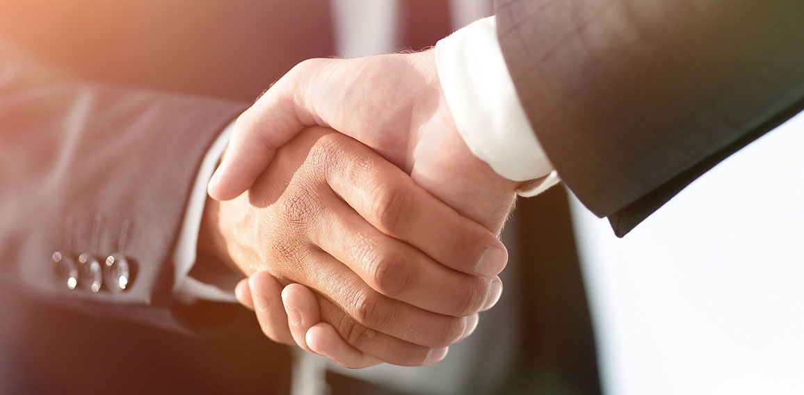 Business men giving a handshake. Business concept