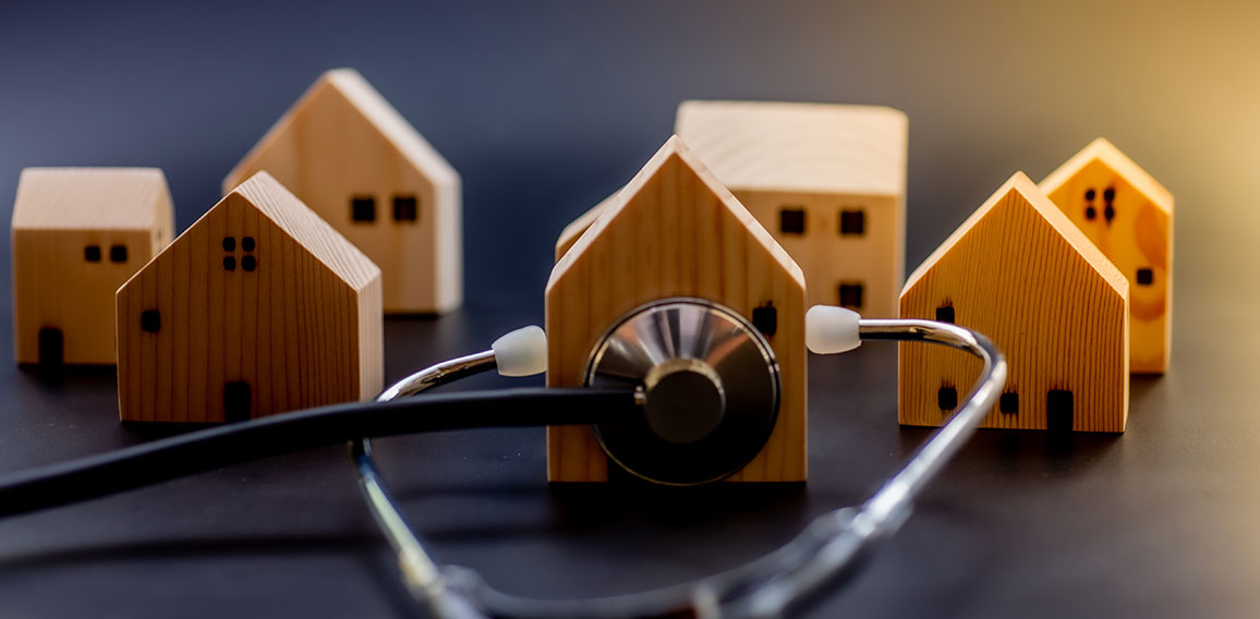 Mini wooden house with Stethoscope using as check up business fi