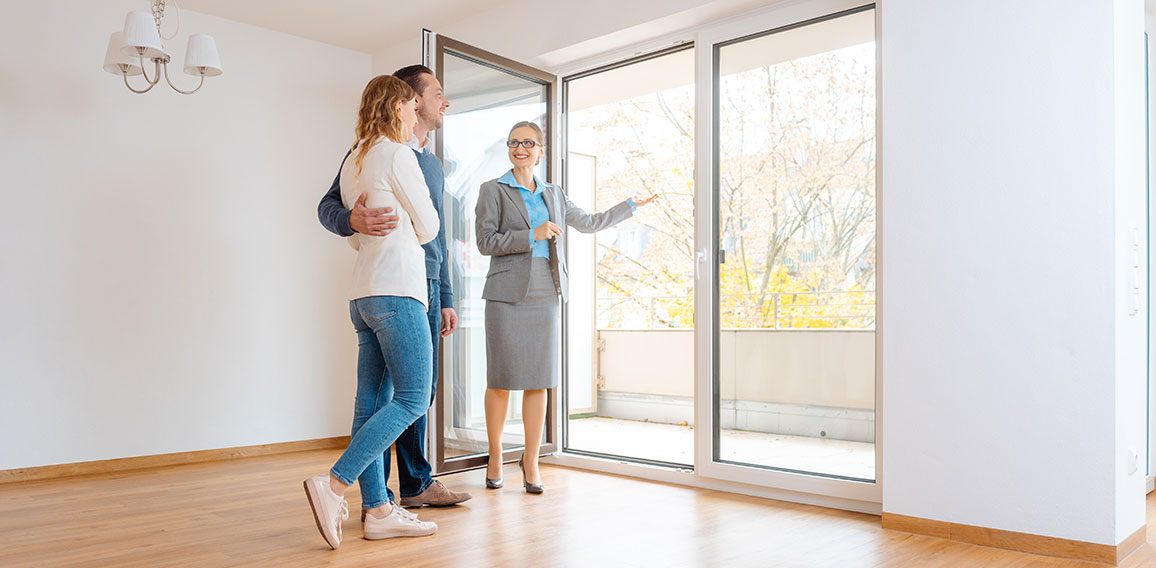 Young couple getting tour through apartment they consider renting