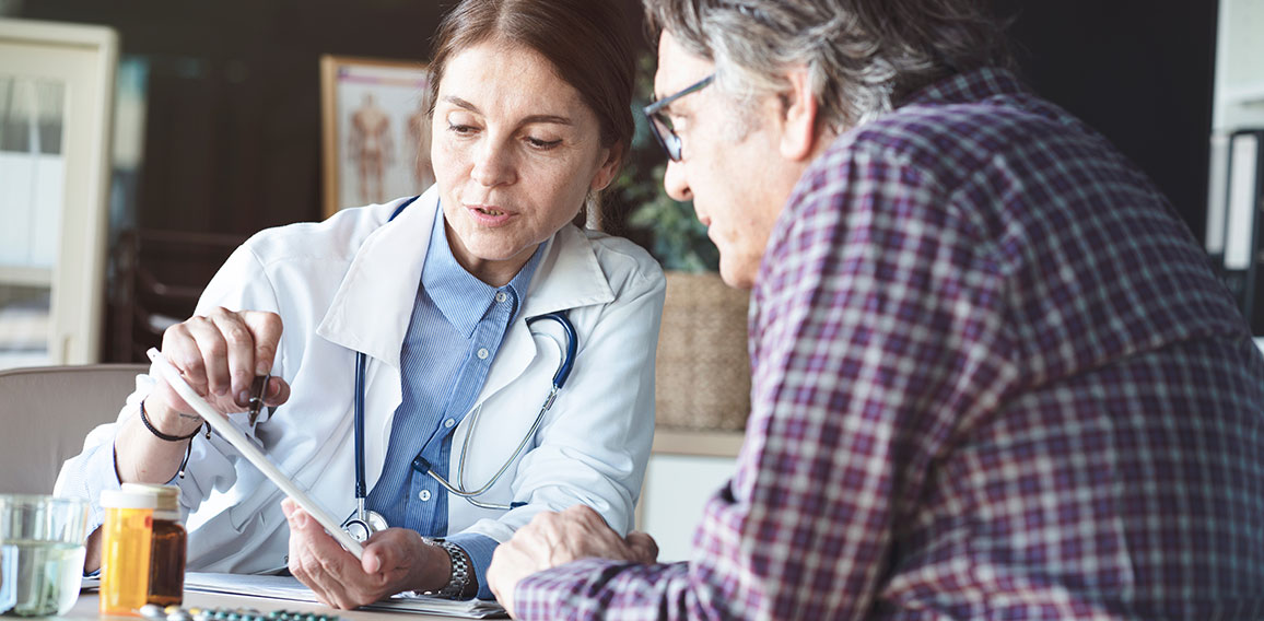 Doctor with patient in medical office