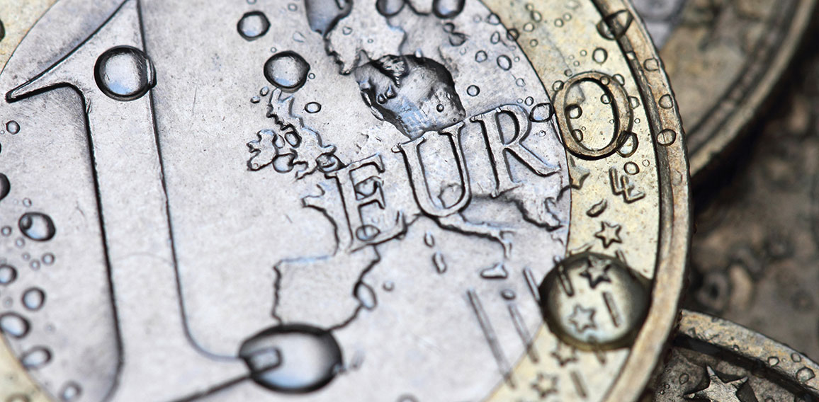 euro coin detail with water drops