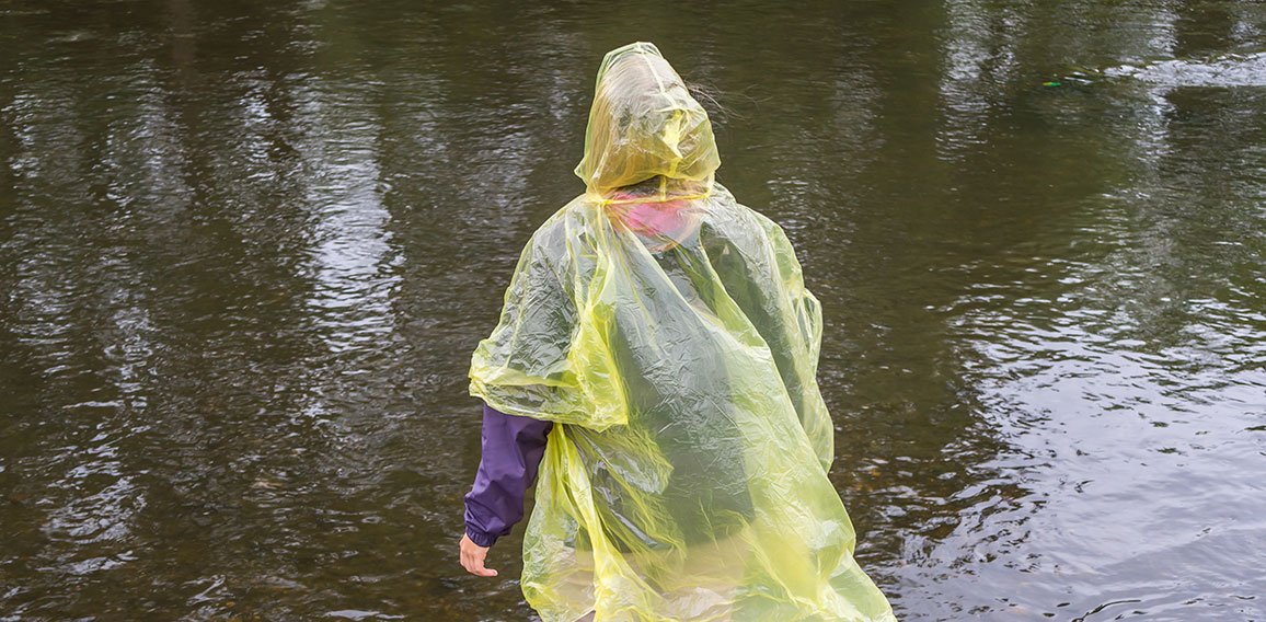 Woman with Rain Coat in the Rain