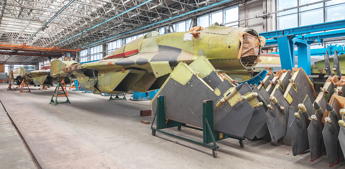 Aviation factory of military aircraft. Assembly of the Russian fighter. Focus on the cockpit