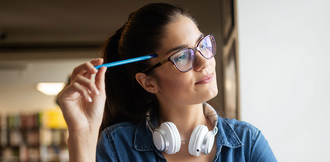 Beautiful student woman studying and learning at college