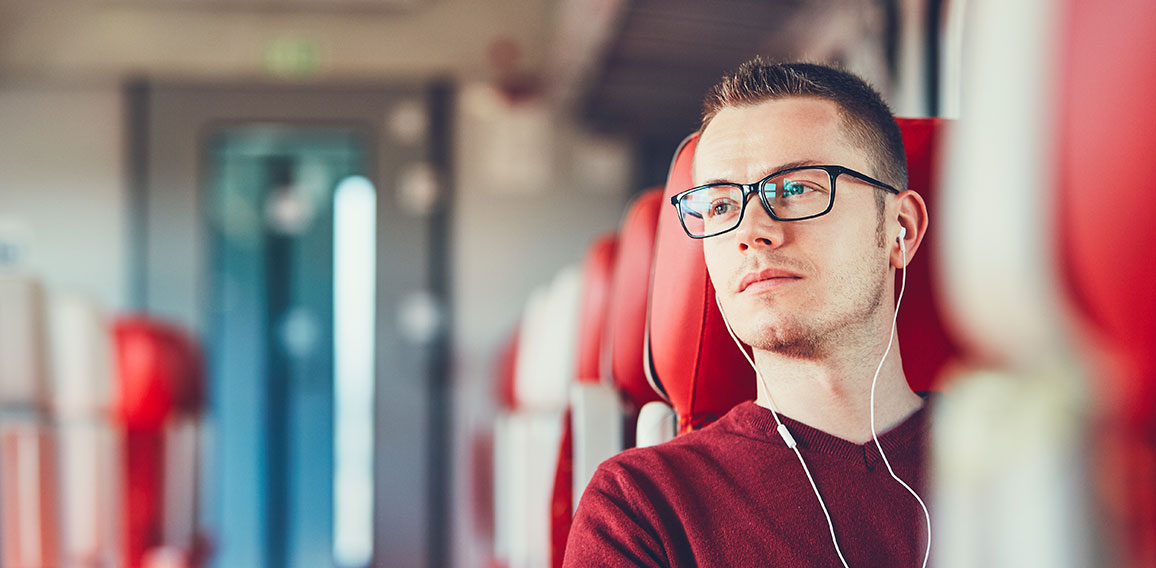 Young man traveling by train